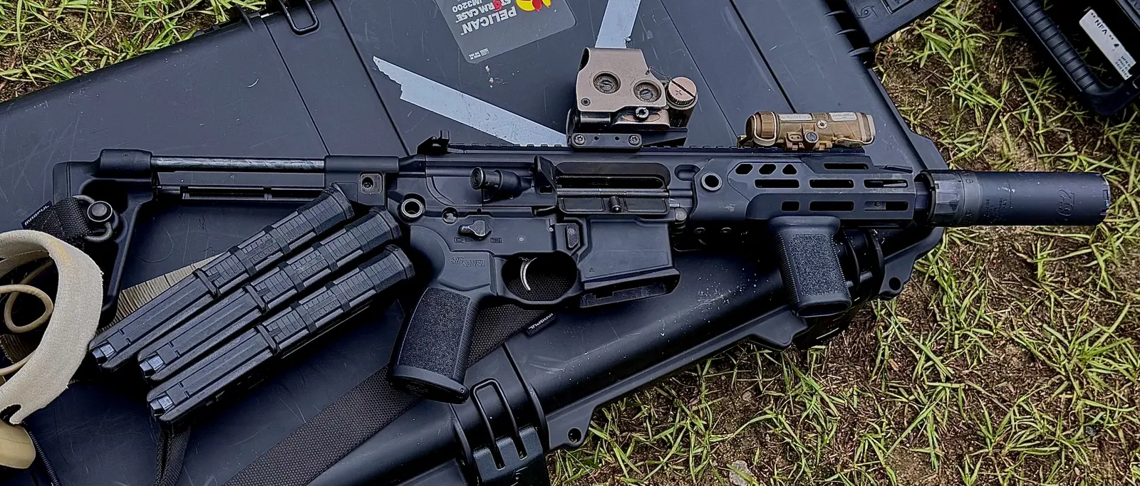 A compact SIG rifle, close detail on the machining and controls.